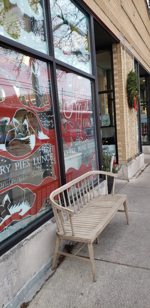 Photo of the front window of the Spilt Milk Pastry bakery in Oak Park, Illinois.